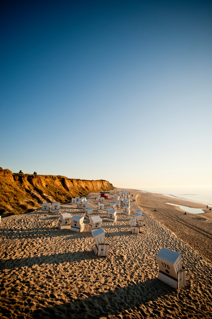 Hooded beach chairs on Westerland beach and Rotes Kliff in Sylt, Germany