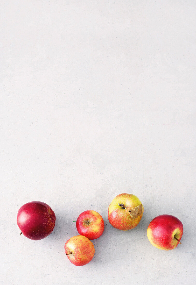 Various apples on white background