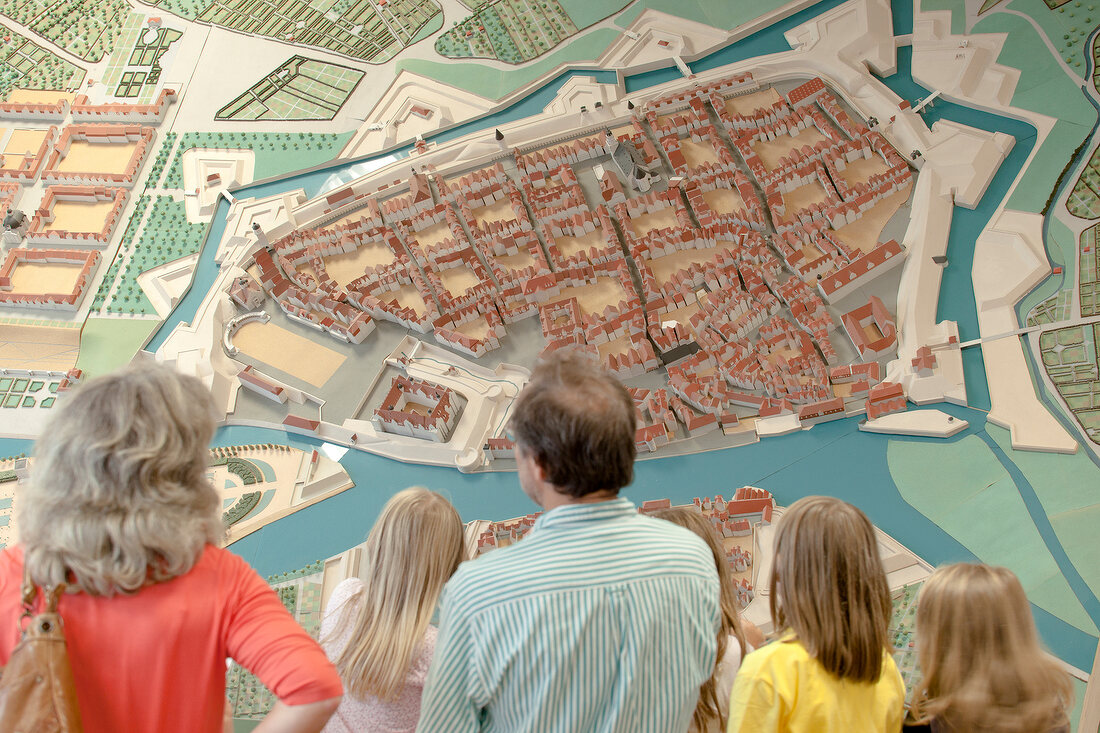 Visitor looking at historical model of city at City Museum, Kassel, Hesse, Germany