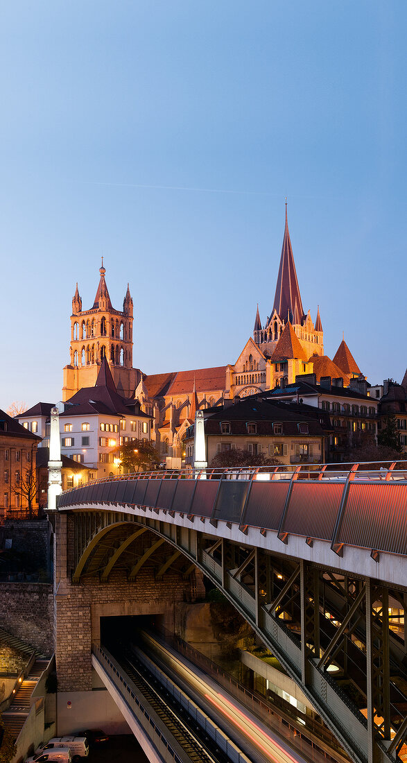 View of houses and Notre-Dame Cathedral at evening in Lausanne, Switzerland