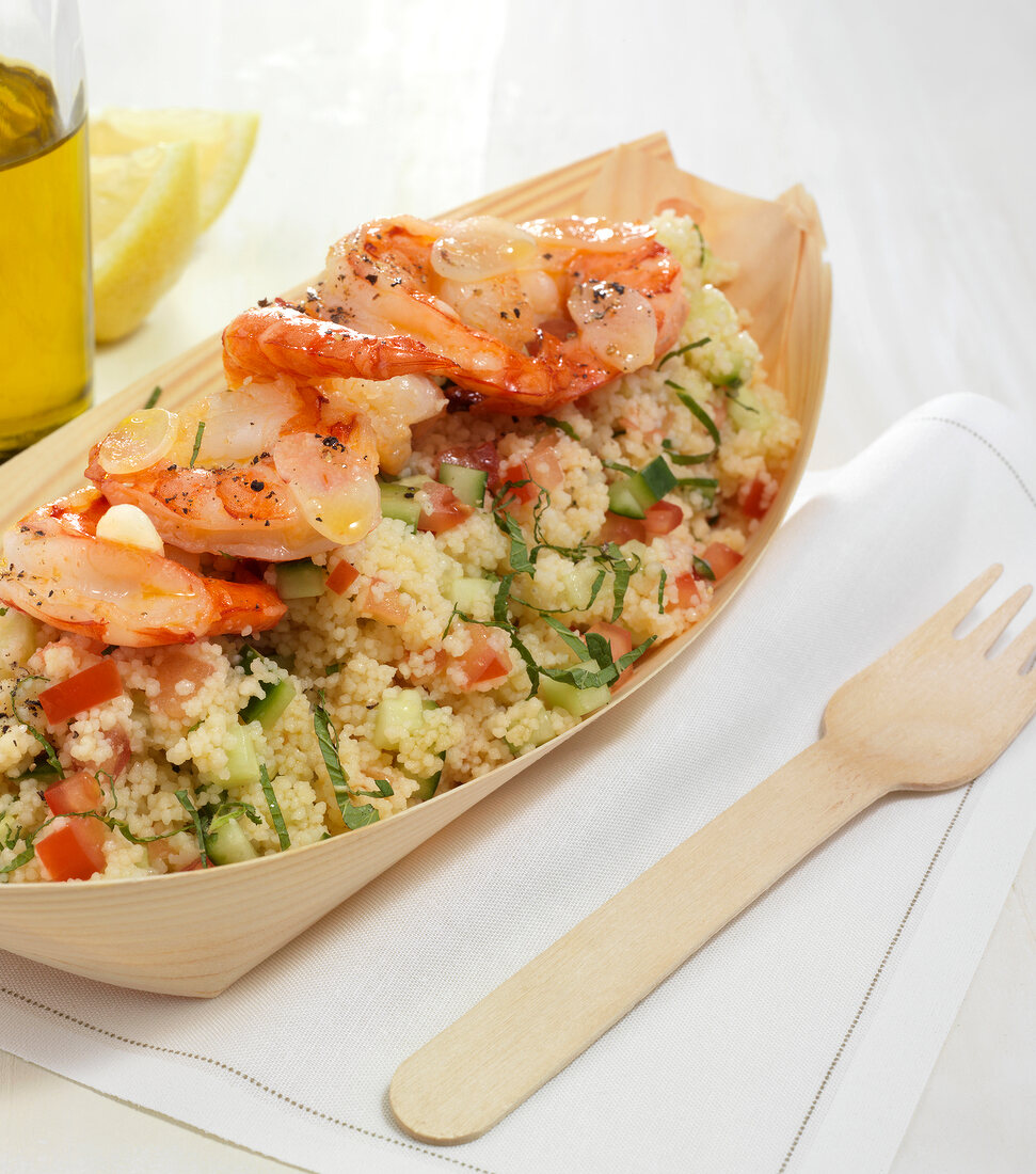 Couscous salad with shrimp on serving dish