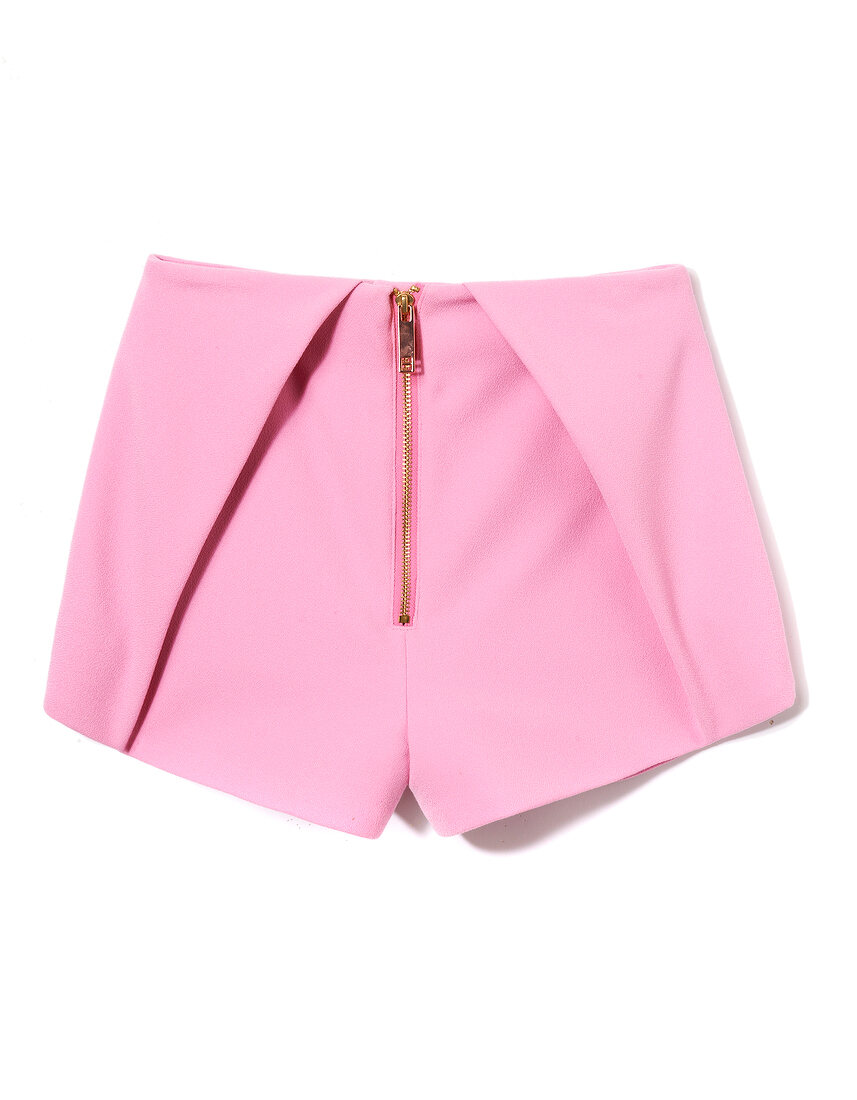 Close-up of pink pleated hot pants with zipper