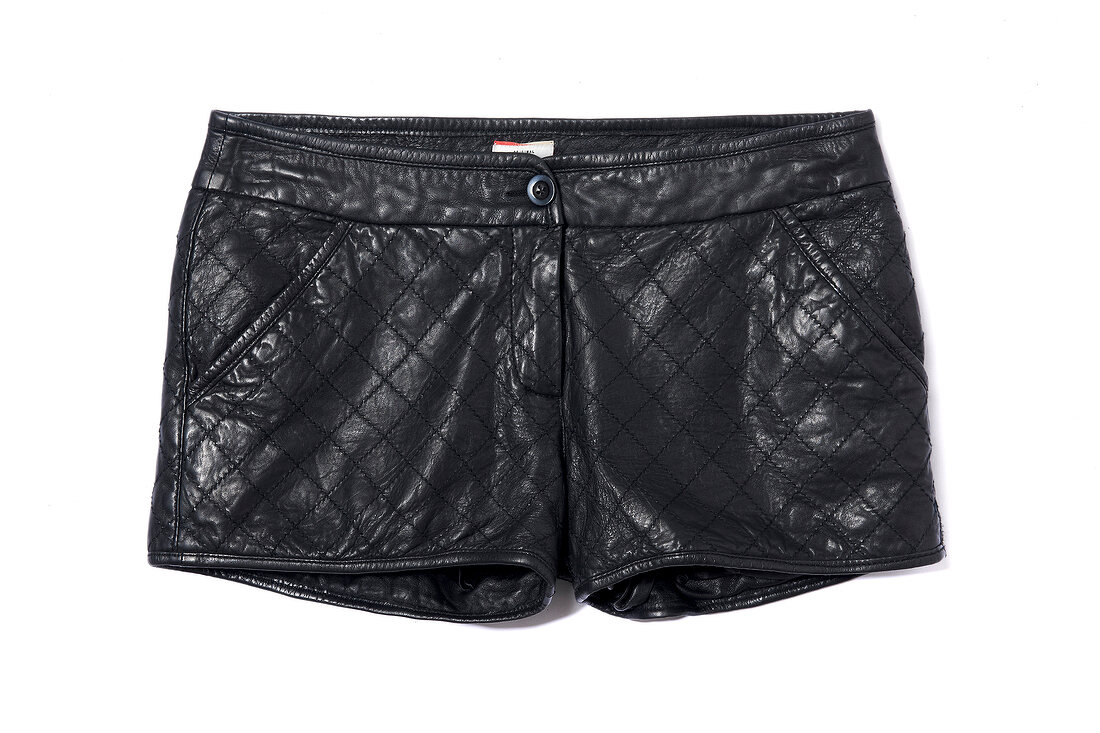 Quilted black leather hot pants on white background