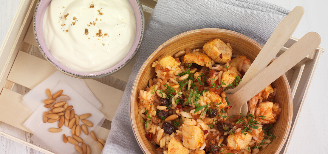 Pilaf with chicken in bowl