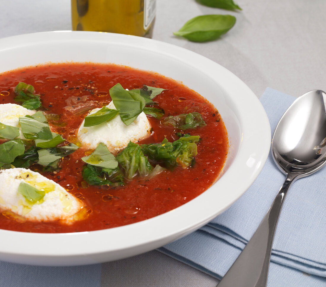 Close-up of tomato soup with ricotta in bowl