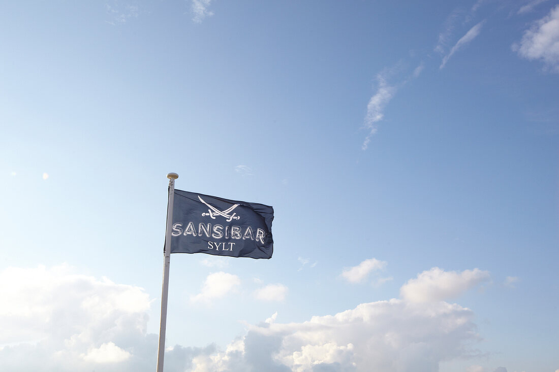 Flag of restaurant Zanaibar with sabre in Rantum, Sylt, Germany
