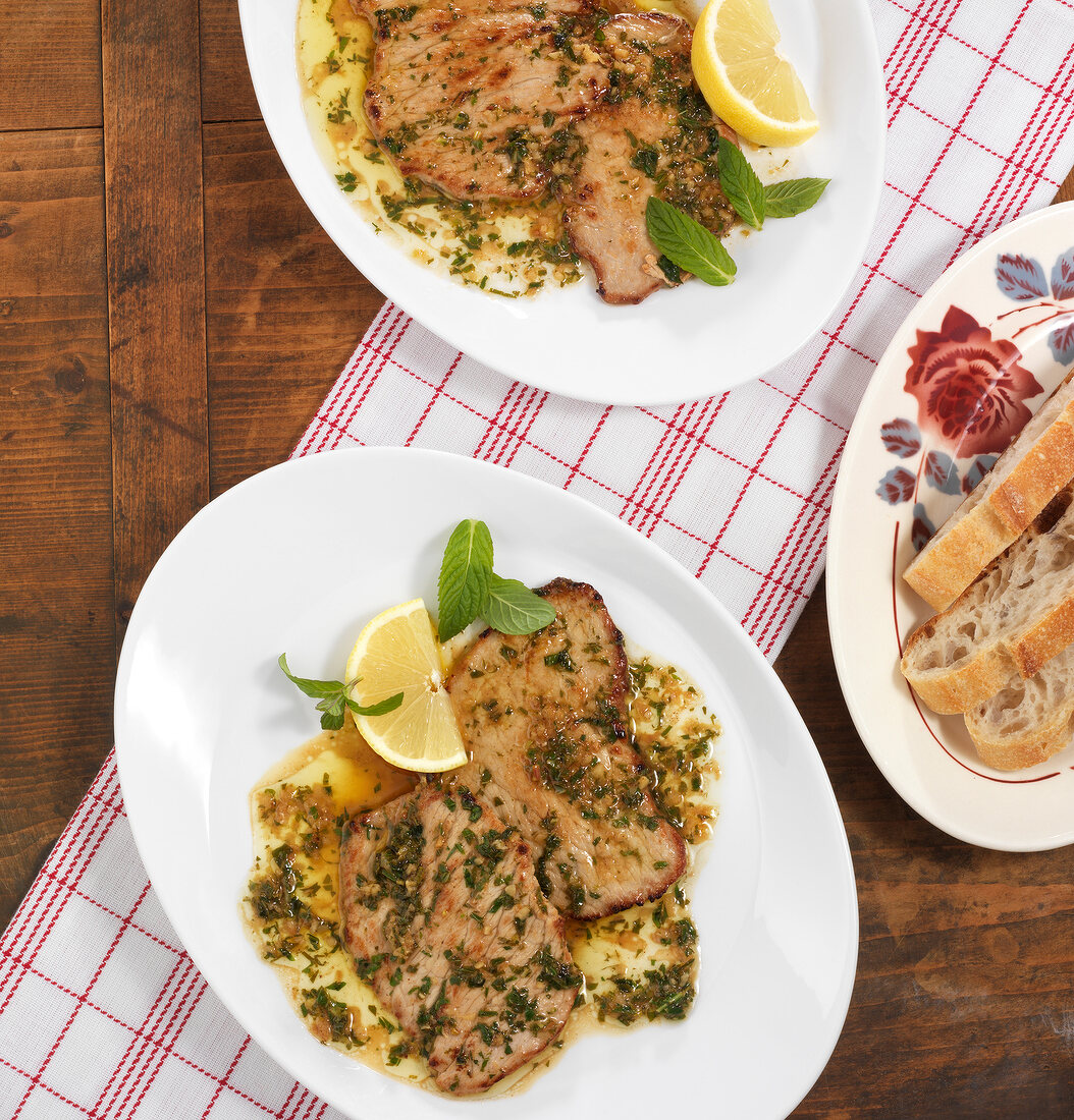 Veal cutlets with minzbutter on plate