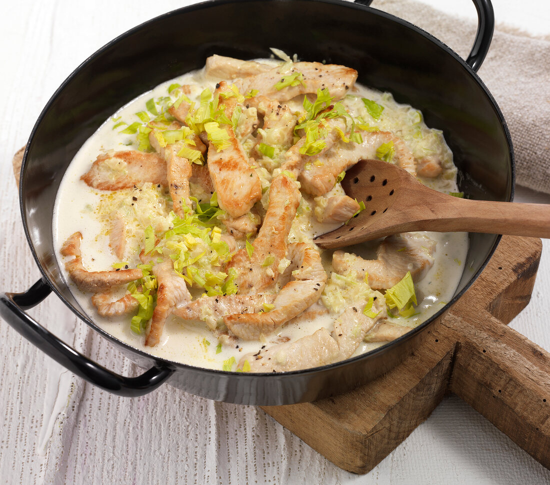 Turkey strips with celery cream in serving dish