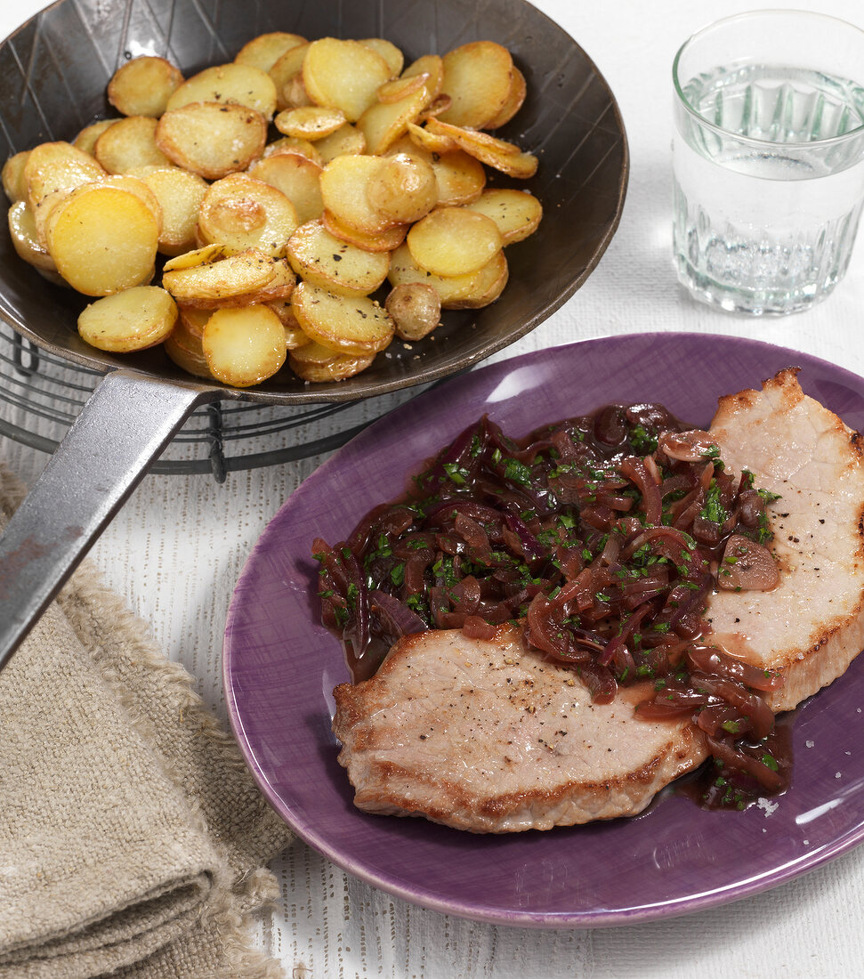 Escalope with balsamic onions on plate