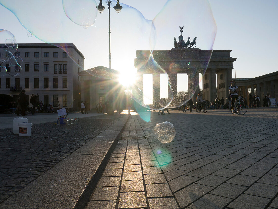 Soap bubbles in front of Brandenburg gate, Mitte, Berlin, Germany