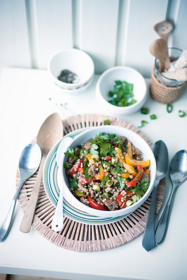 Fried minced meat and vegetables with buckwheat