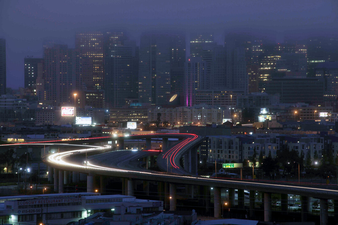 View of skyline and city street at night in San Francisco, California, USA, long exposure