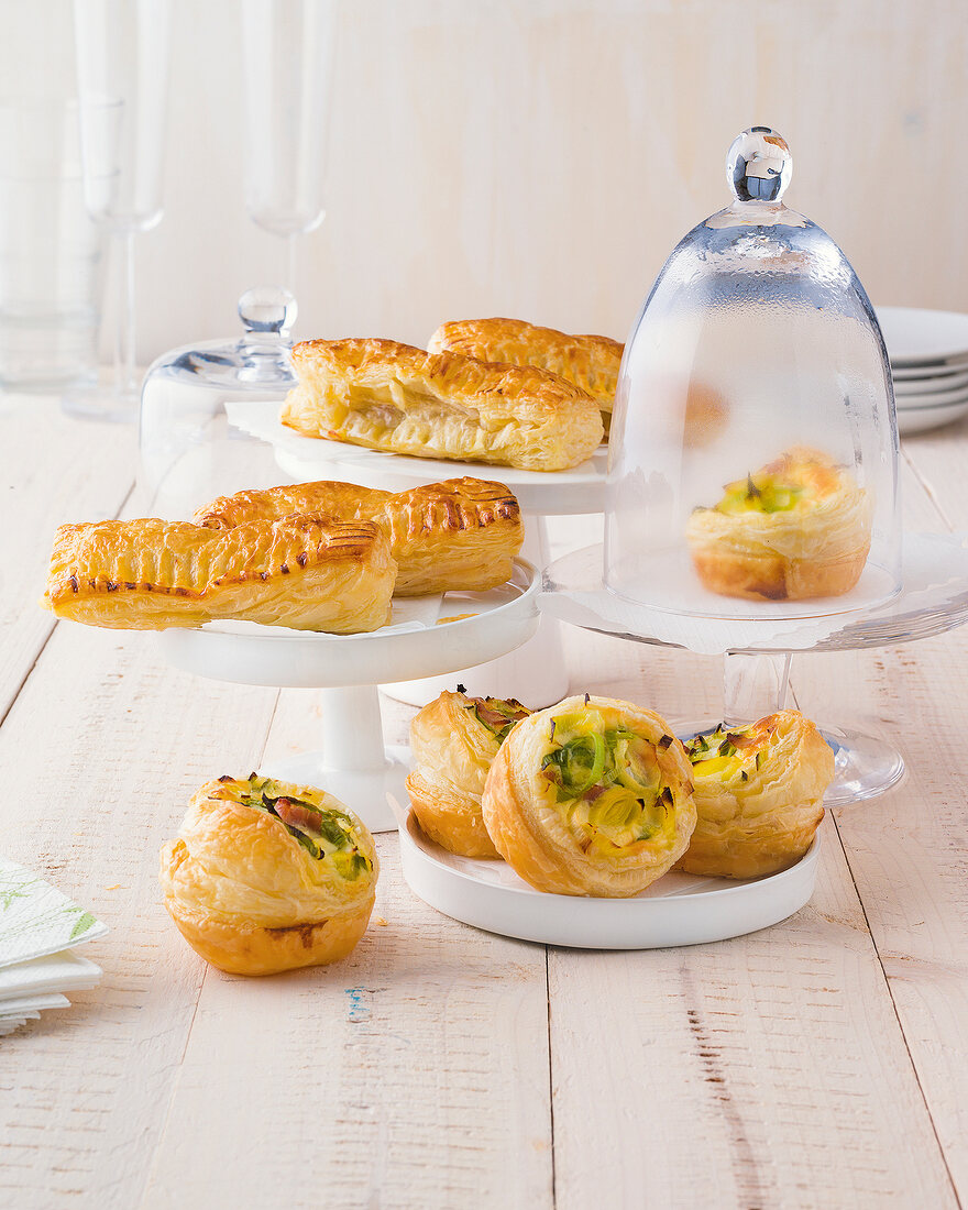 Minced meat bags and lauchpastetchen on plate and cake stands