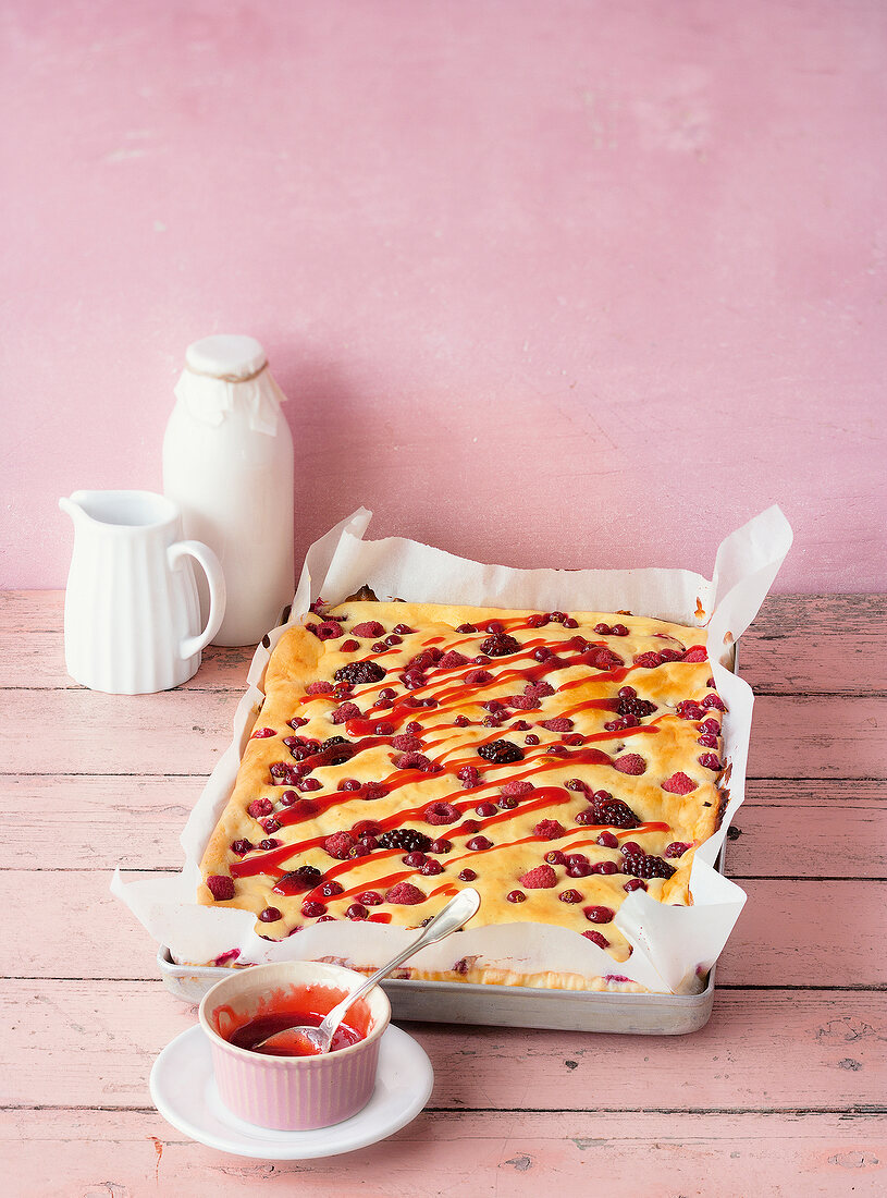 Sheet cake of berry cheesecake in baking tray