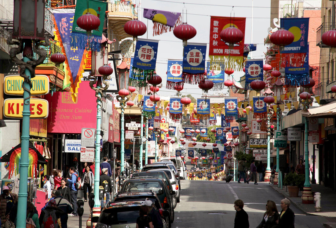 Busy street of Chinatown overlooking the Bay Bridge in San Francisco