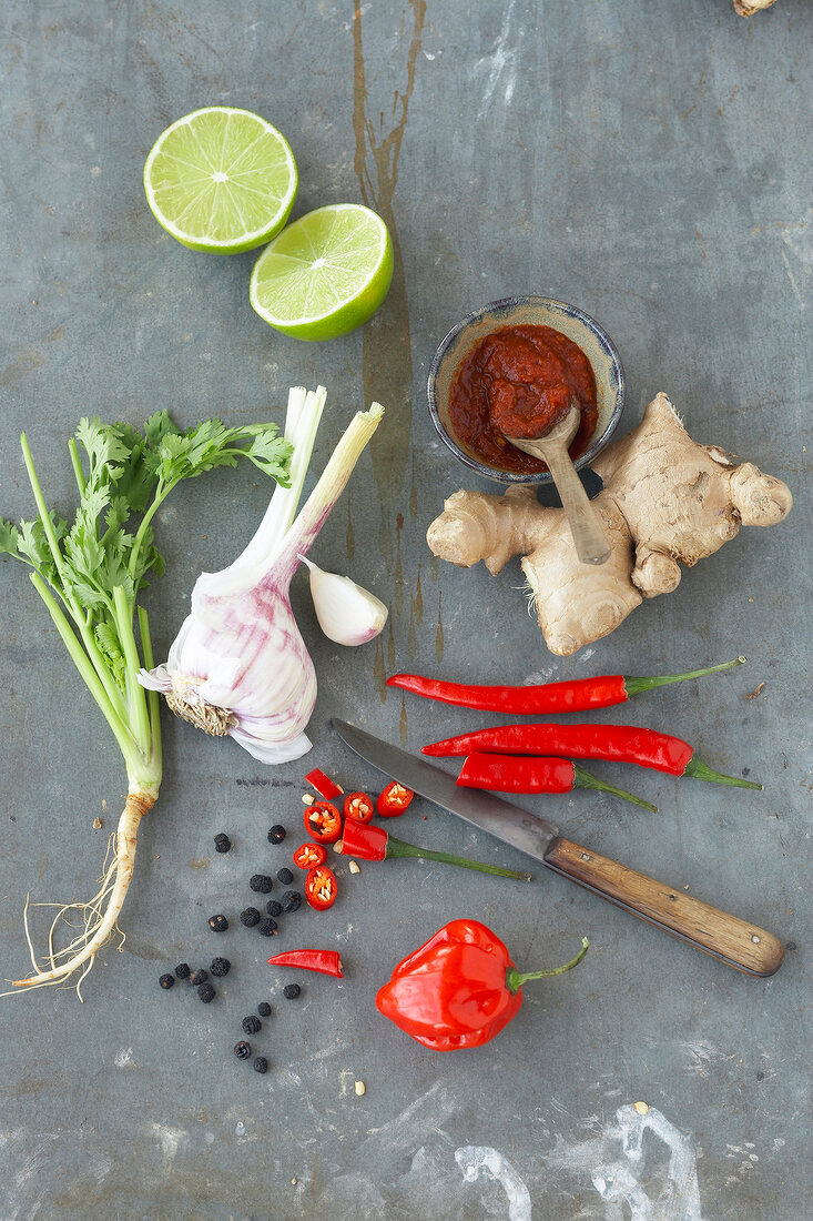 Coriander, garlic, chilli, lime and ginger with knife