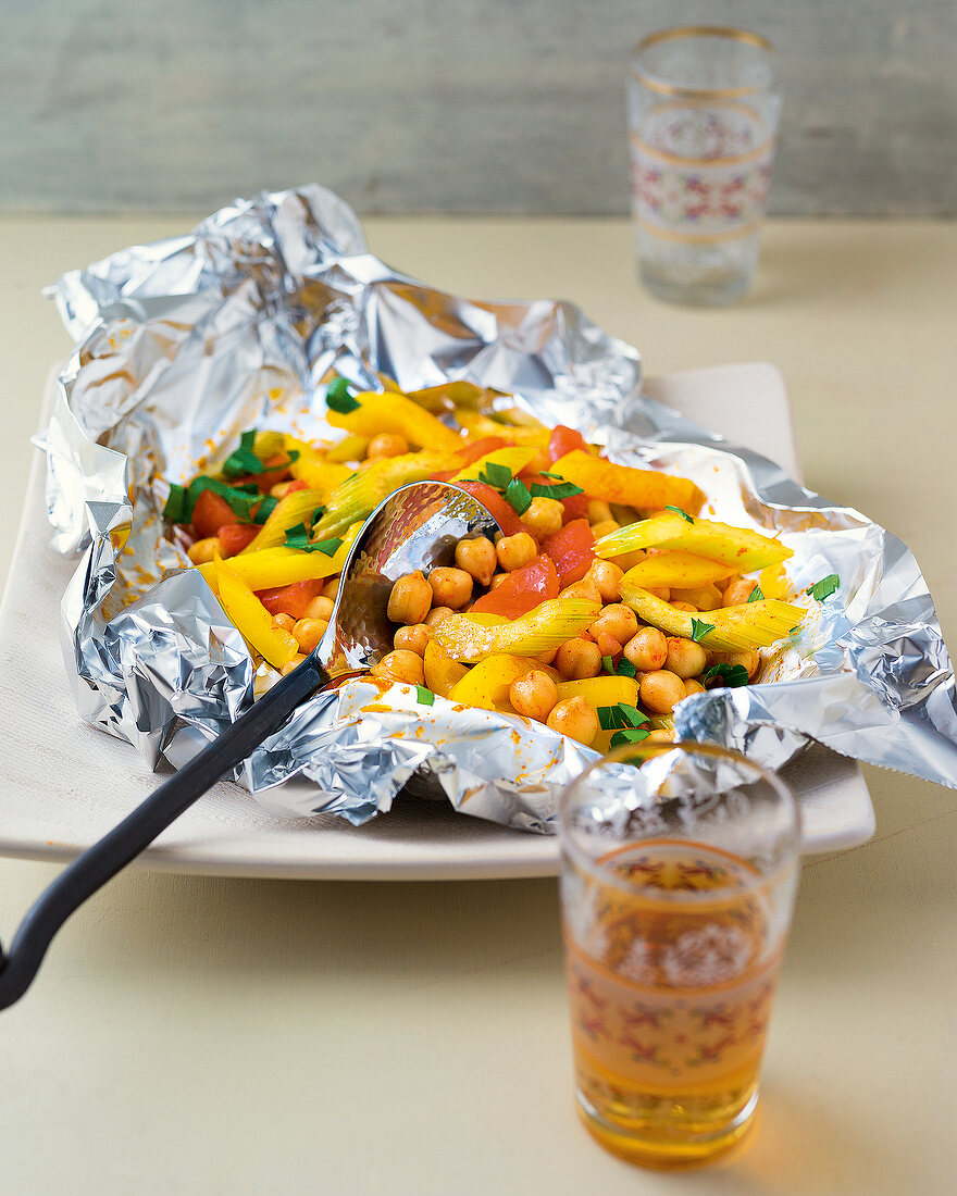 Spicy chickpeas with vegetables in foil