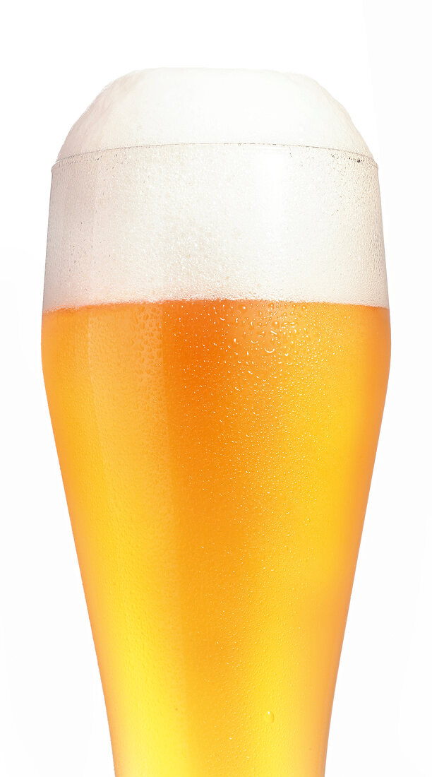 Close-up of beer glass on white background