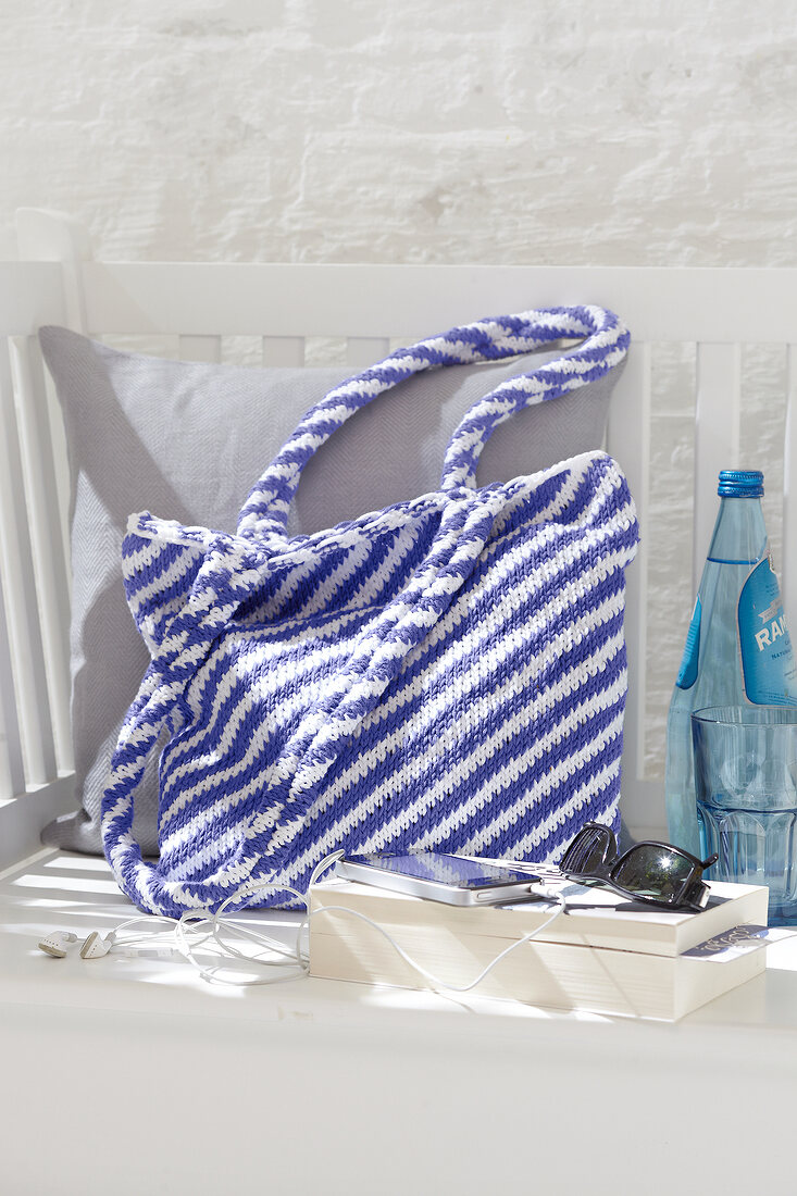 Knitted handbag with blue and white stripes