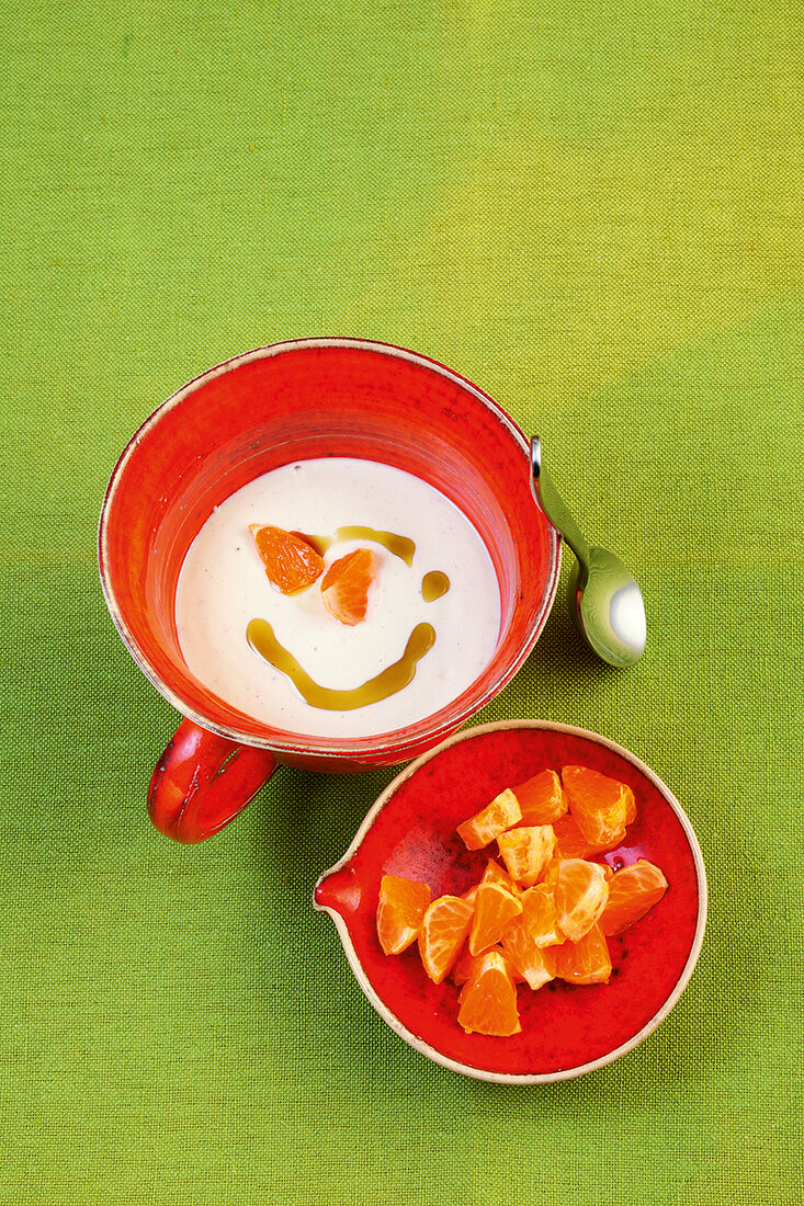 Mandarin orange cashew cheese in cup bowl