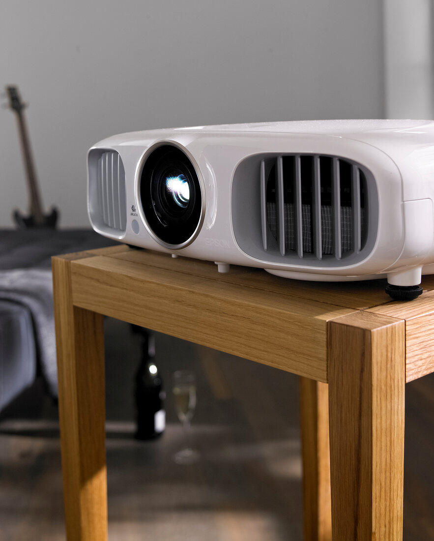 Living room with white HD projector on table