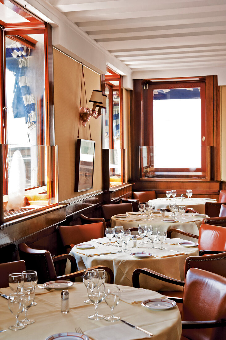 Tables laid in Harry's bar, Venice, Italy