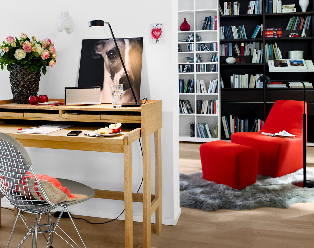 Office with secretary desk, bookshelves and chairs