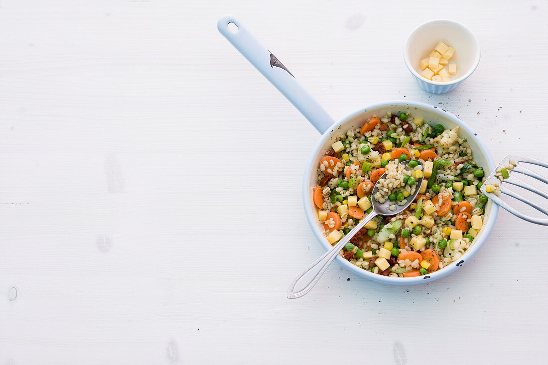 Stir fried wheat and vegetable in pan