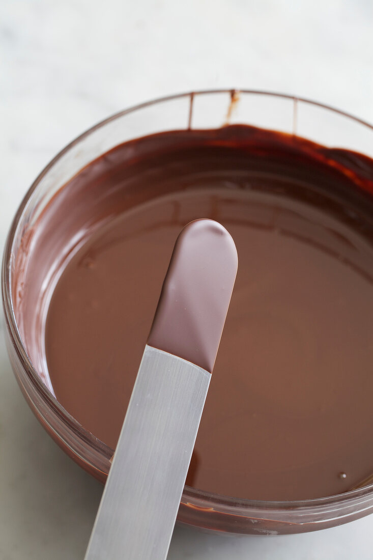 Consistency of melted chocolate being tested