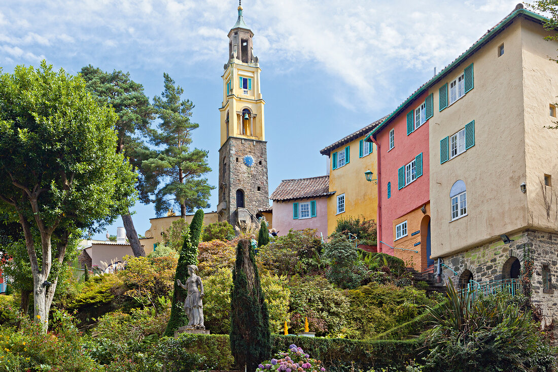 Low angle view of church with bell tower and tress in Portmeirion village, Gwynedd, Wales