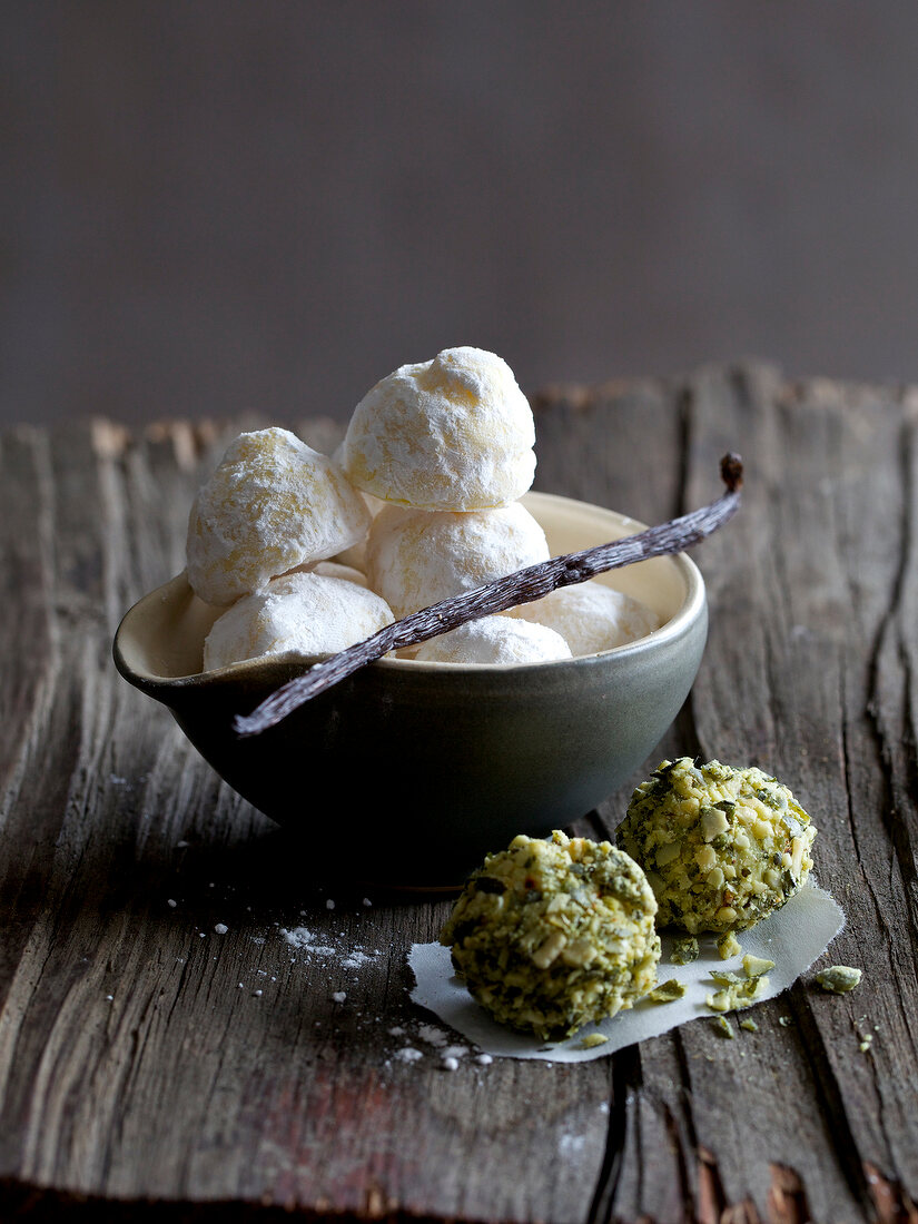 Vanilla truffles in bowl and pumpkin truffles next to bowl