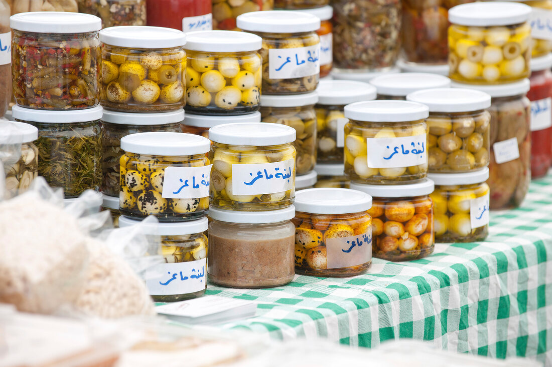 Stack of homemade pickles in containers in Souk El Tayeb organic market, Beirut, Lebanon