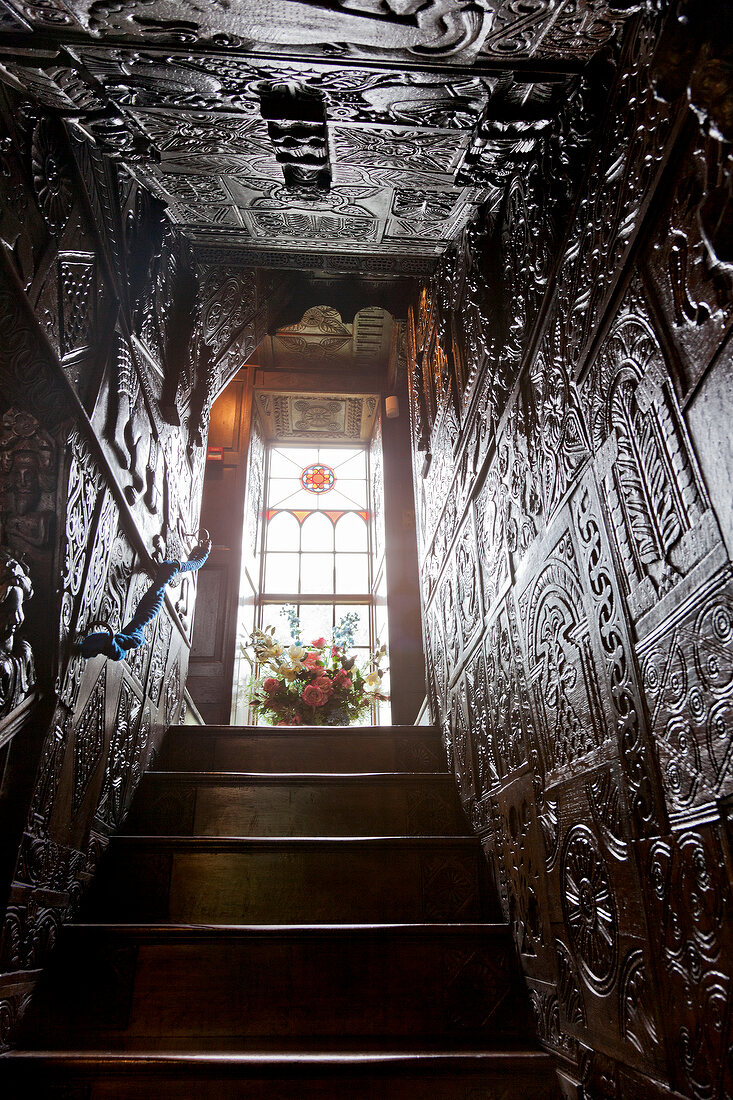 Wooden staircase with carvings in Plas Newydd museum, Llangollen, Denbighshire, Wales, UK