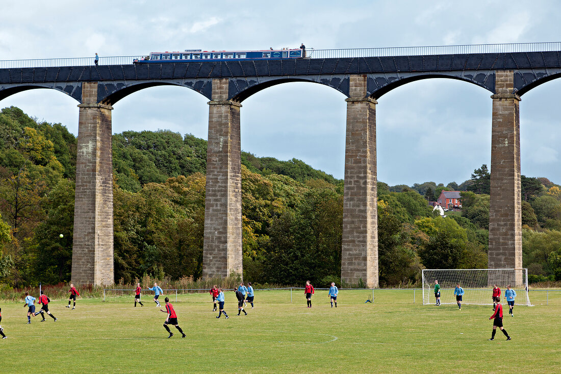 People playing football at Pontcysyllte Aqueduct in Denbighshire, Wales, UK
