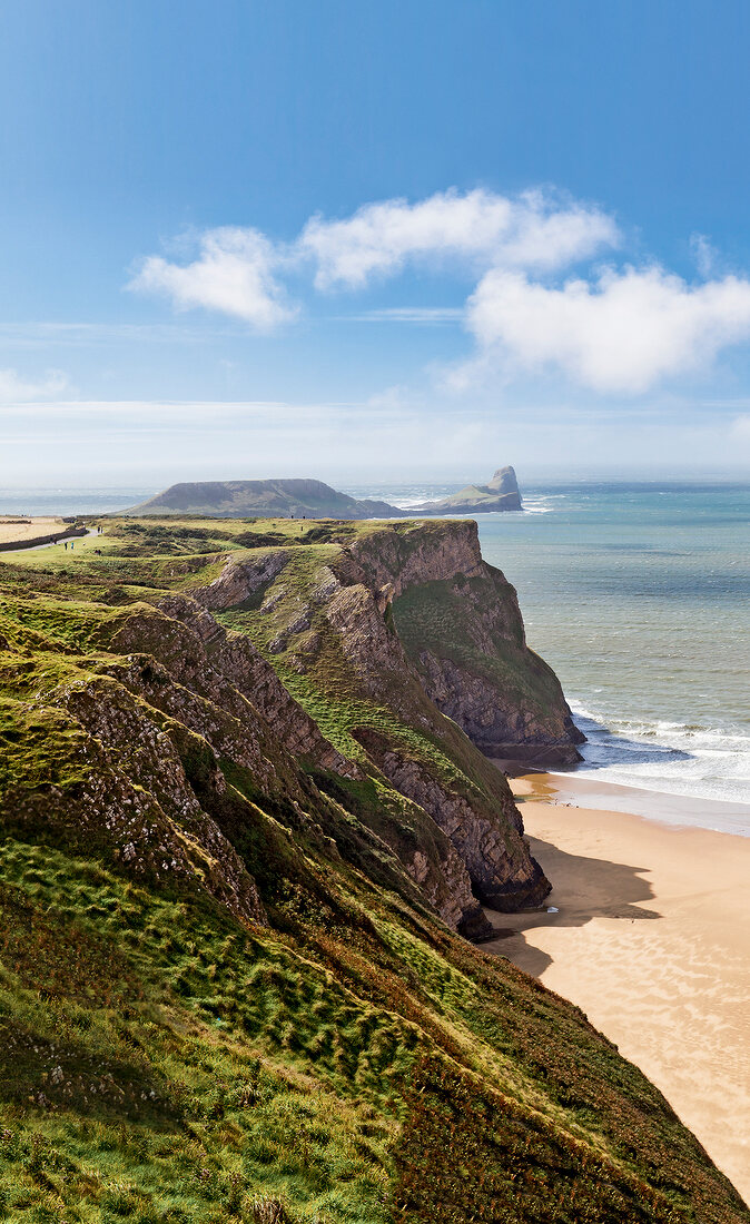 View of Atlantic Ocean and Worm's Head from Rhossili cliffs in Gower Peninsula, Wales, UK