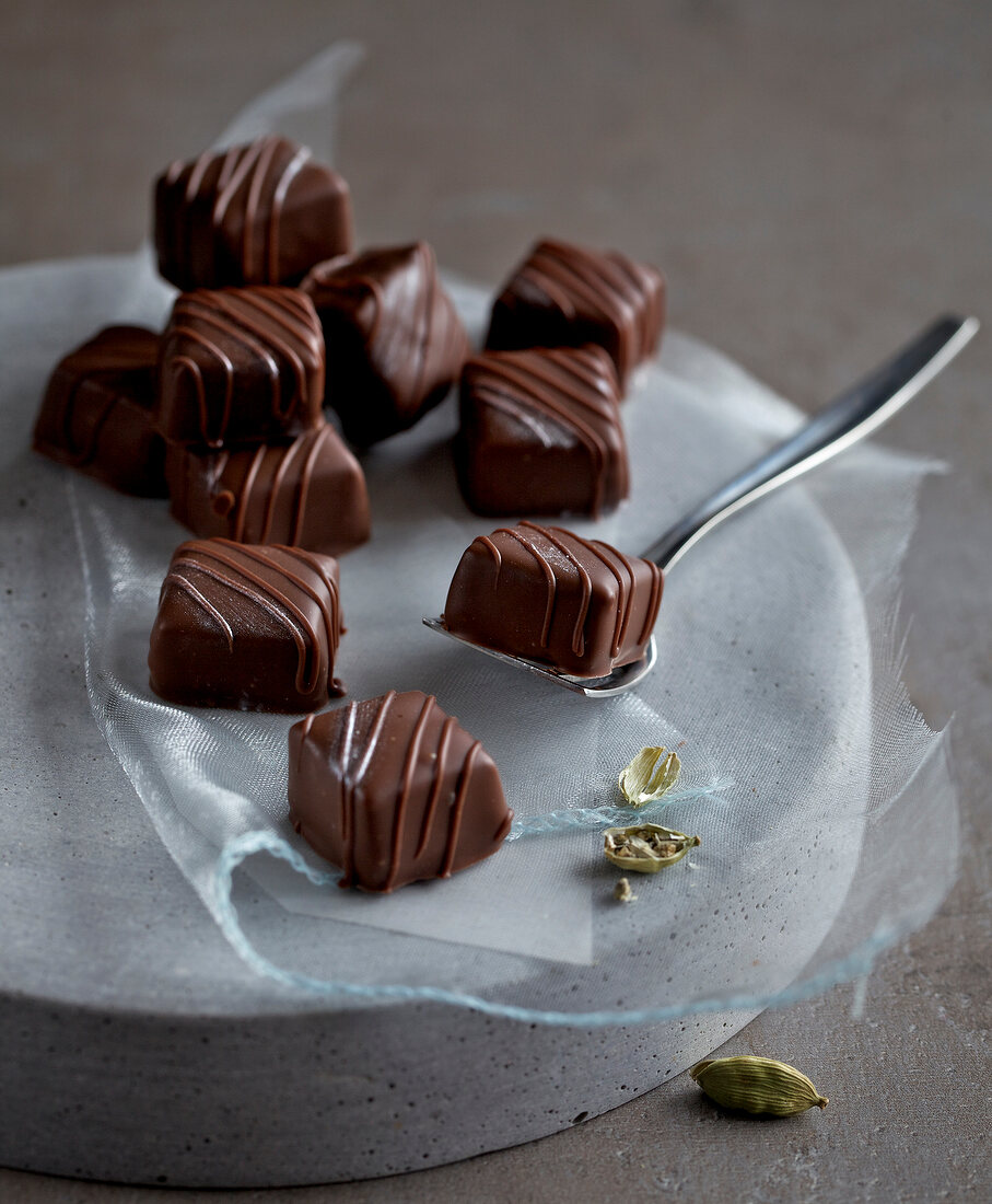 Cubes of cardamom honey chocolate on net