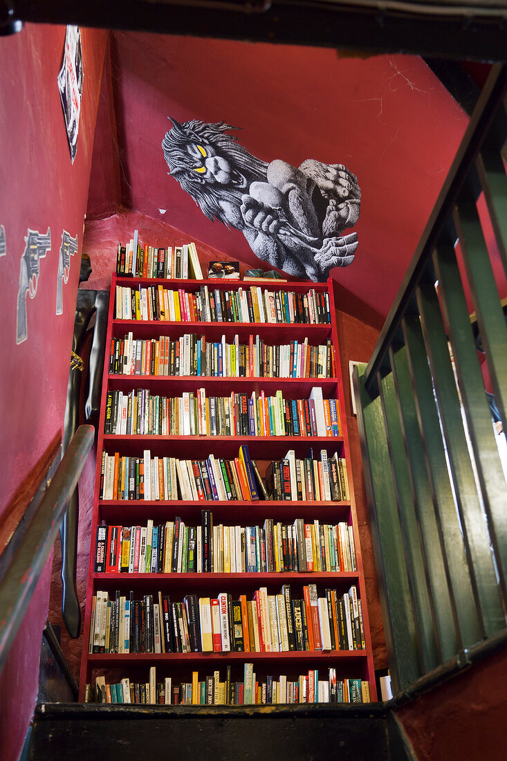 Books arranged in shelf at bookstore in Hay-on-Wye village, Powys, Wales, UK