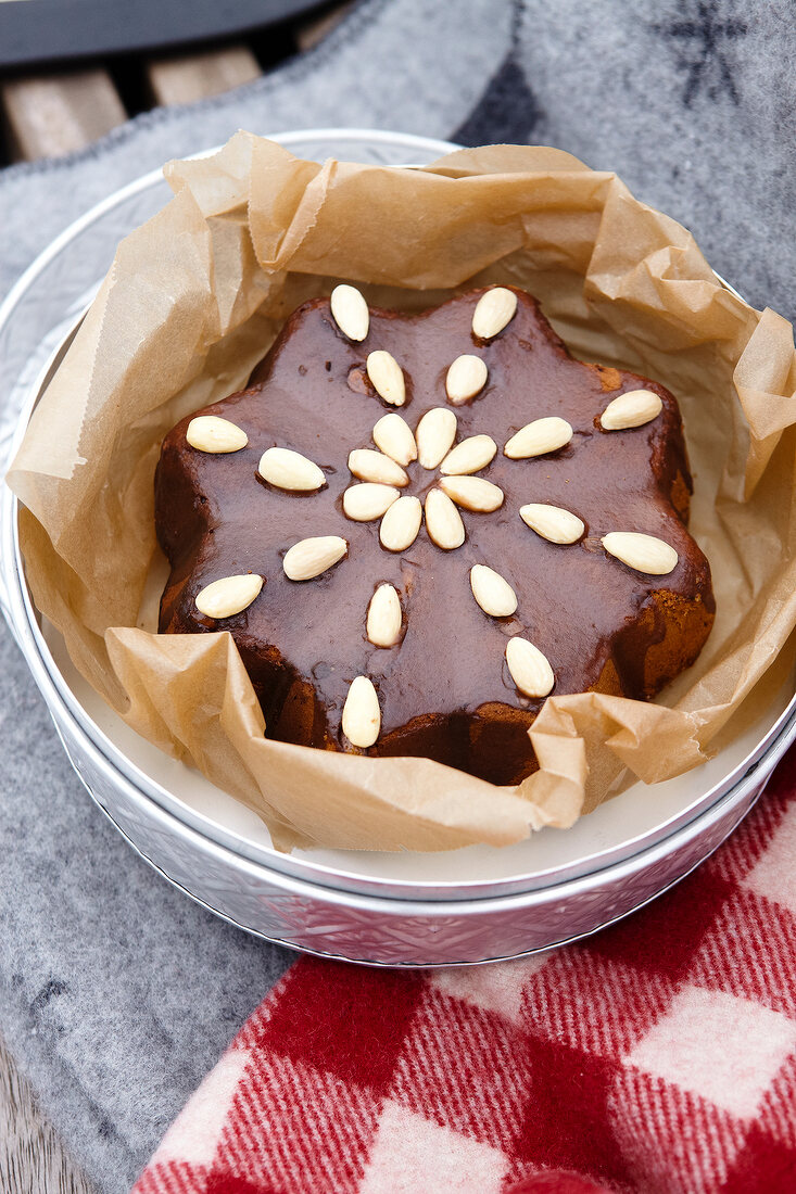 Star shaped almond cake in greaseproof paper
