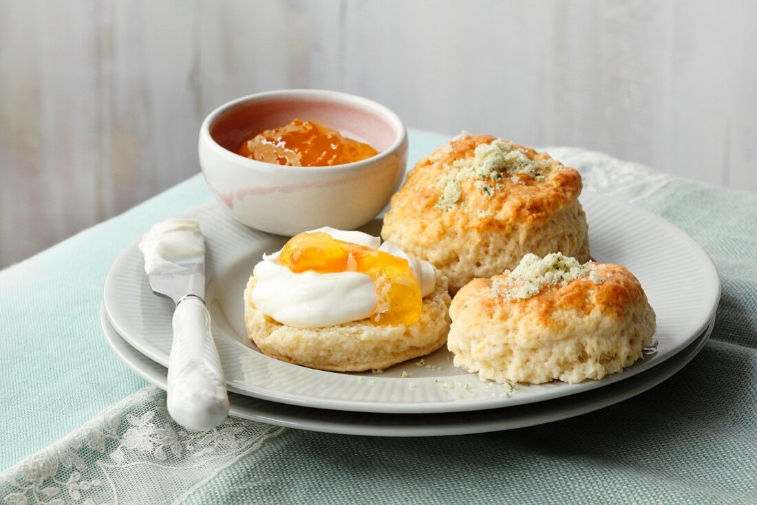 Rosemary scones with clotted cream and apricot jam