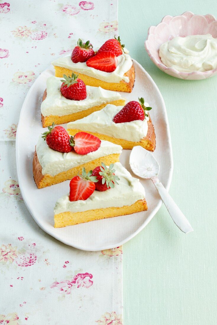 Pumpkin sponge cake with strawberries and avocado cream