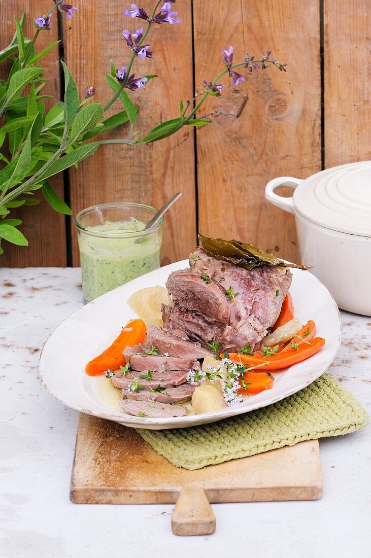 Poached leg on lamb with pesto and carrots