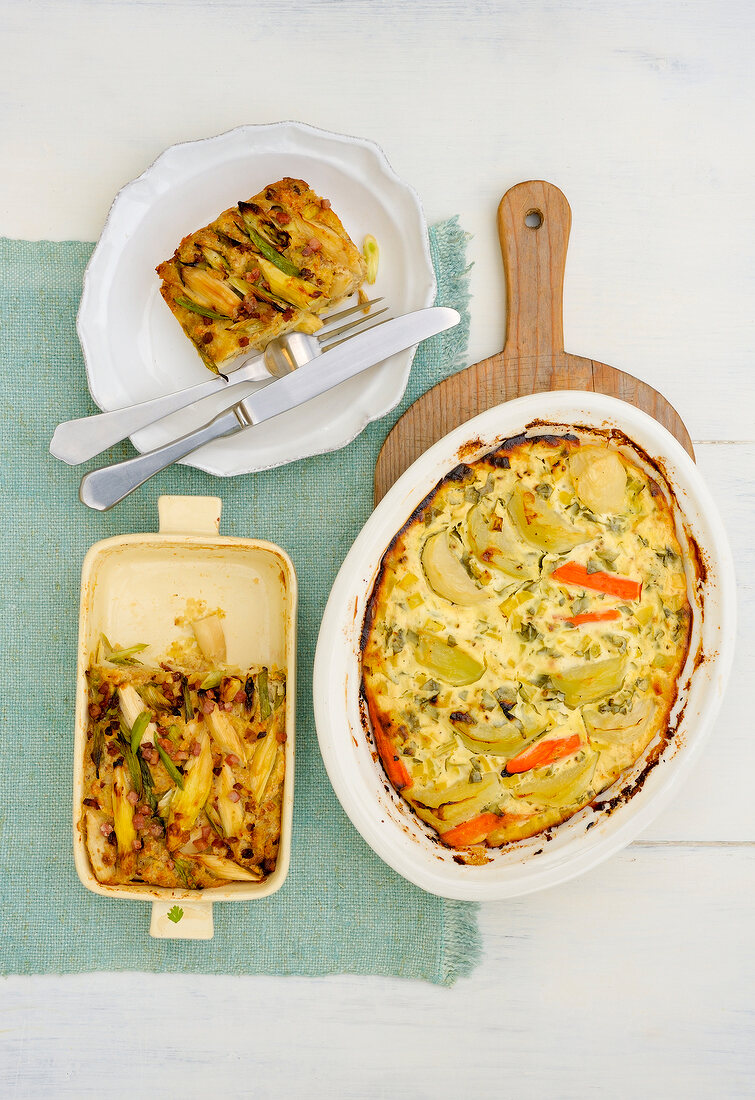 Asparagus bread pudding and vegetable gratin on plate