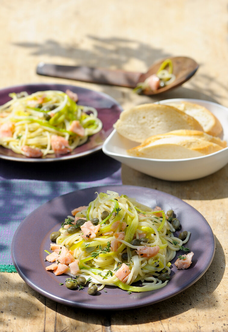 Salmon fillet and leek pasta on plate