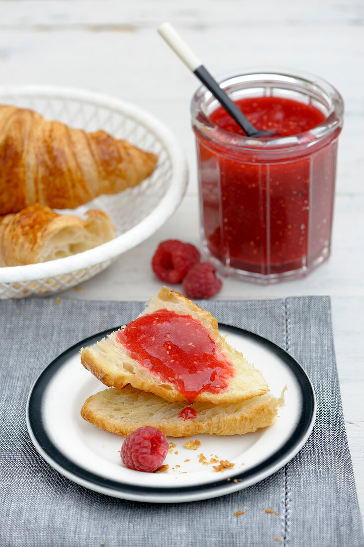Bread with raspberry jam on plate
