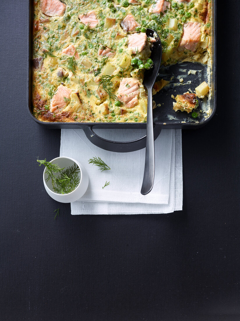 Vegetable frittata with salmon caviar tobiko in baking dish