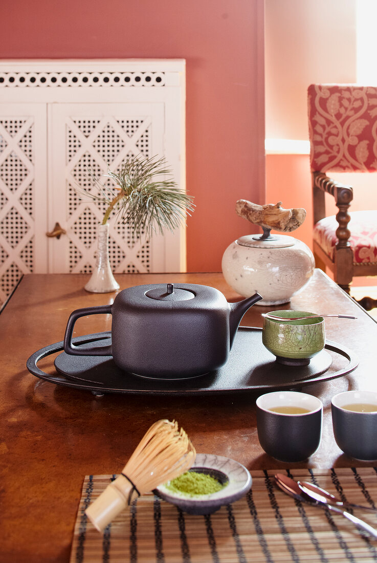 Porcelain tea set with teapot, tea powder and bamboo broom