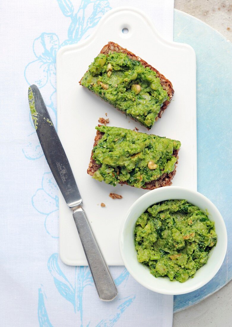 Two slices of wholemeal bread topped with a wild garlic and potato spread