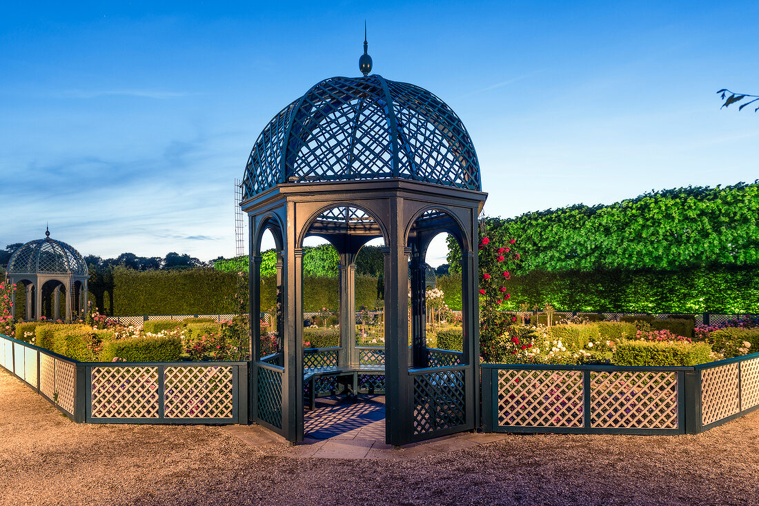 Gazebo and rose plant in Royal gardens of Herrenhausen Palace, Hanover, Germany