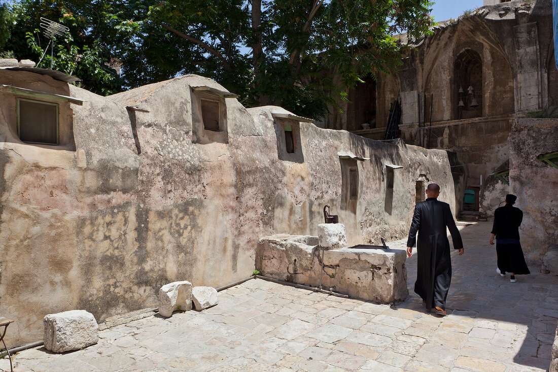 Ethiopian monks walking at Church of the Holy Sepulchre, Jerusalem, Israel