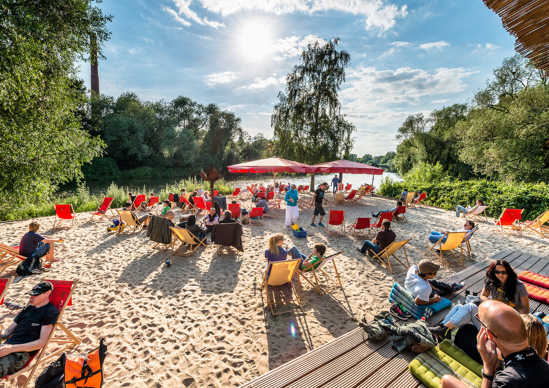 People relaxing on beach at Weddige bank 29 in Linden, Hannover, Germany